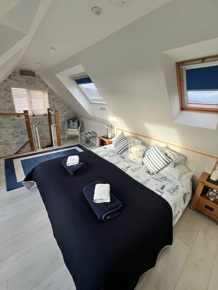 Super-king bedroom in the eaves of The Boat House