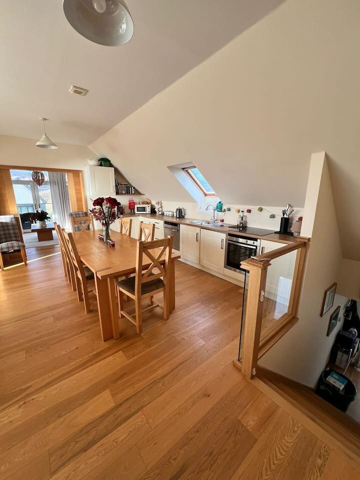 Open-plan kitchen and dining area in The Sunset Loft